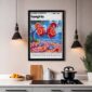 a framed picture of a drink on a kitchen counter