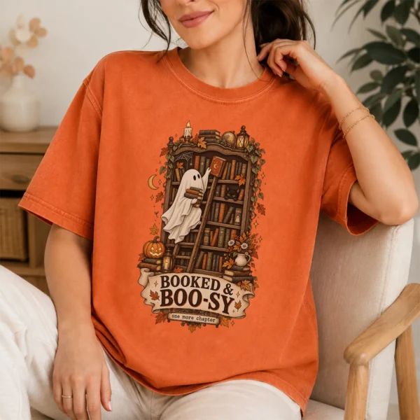 Booked & Boo-sy Ghost, Cozy Halloween Library Book Lover — lifestyle mockup Booked & Boo-sy Halloween ghost shirt t-shirt lifestyle scene