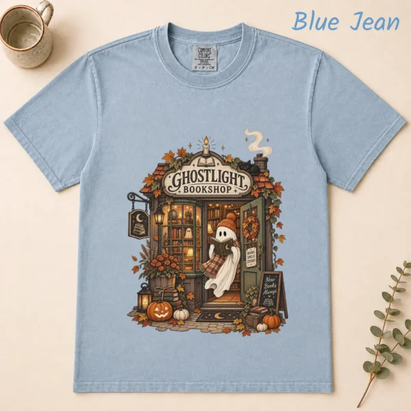 Ghostlight Bookshop Ghost, Spooky Autumn Book Lover — alternate product mockup Ghostlight Bookshop Halloween Shirt t-shirt flat lay view