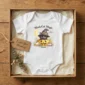personalized black cat magic baby bodysuit styled product photo