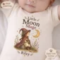 personalized moon mage baby bodysuit styled product photo
