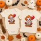 creepy clown baby bodysuit flat lay view