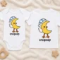 crescent moon bird baby bodysuit styled product photo