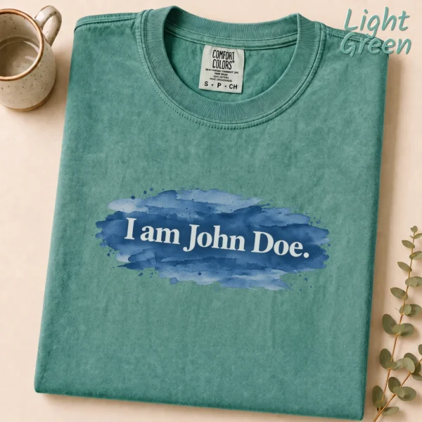 Lettering Multi Style Apparel I Am John Doe. Shirt — alternate product mockup i am john doe lettering multi-style apparel t-shirt product photo