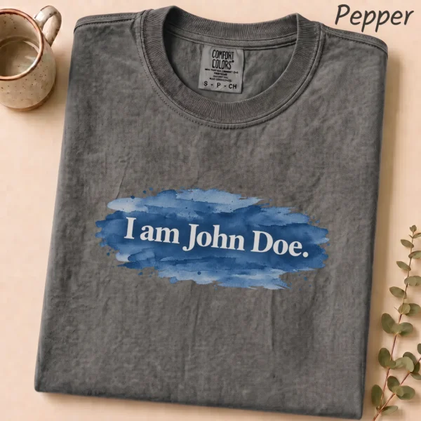 Lettering Multi Style Apparel I Am John Doe. Shirt — alternate product mockup i am john doe lettering multi-style apparel t-shirt close-up detail