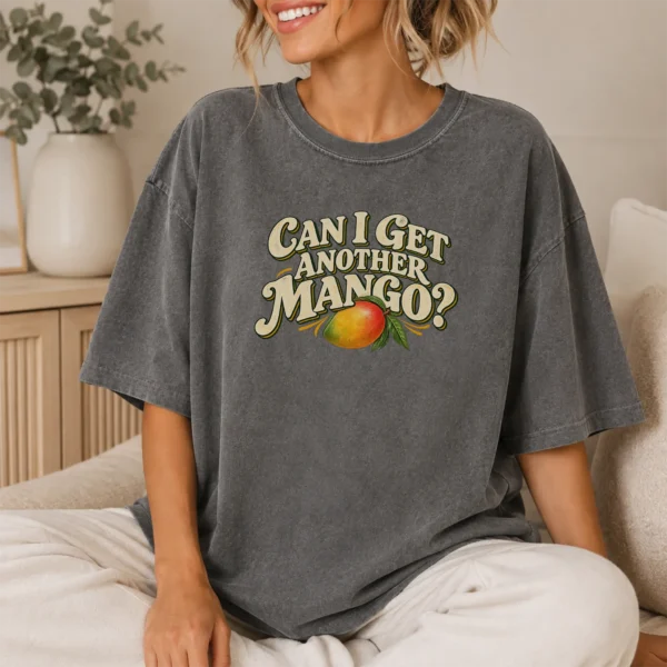 Illustrated Ripe Multi Style Apparel Can I Get Another Mango? Shirt — lifestyle mockup illustrated ripe mango multi-style apparel t-shirt lifestyle scene