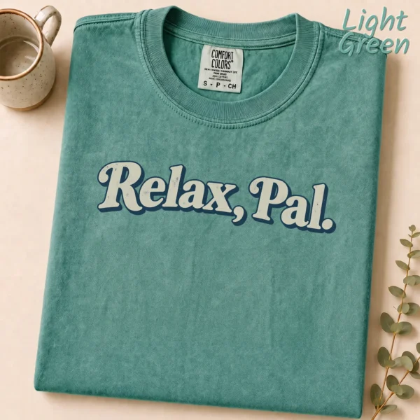 Typography Multi Style Apparel Relax, Pal. Shirt — alternate product mockup relax pal typography multi-style apparel t-shirt styled product photo